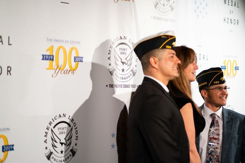 Attendees have their photo taken on the red carpet before American Legion Palisades, Calif., Post 283's "A Celebration for Medal of Honor," at The Theatre at Ace Hotel, in Los Angeles on Saturday, March 2, 2019. (Photo by Lucas Carter/The American Legion)