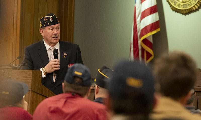 Legionnaire at a podium addressing attendees of Legion College