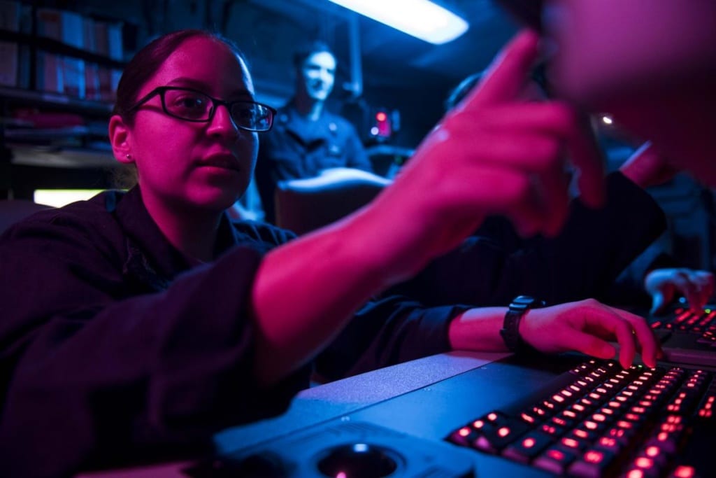 Cryptologic Technician (Collection) 3rd Class Ambar Morales-Diaz analyzes data aboard the aircraft carrier USS Theodore Roosevelt (CVN-71).