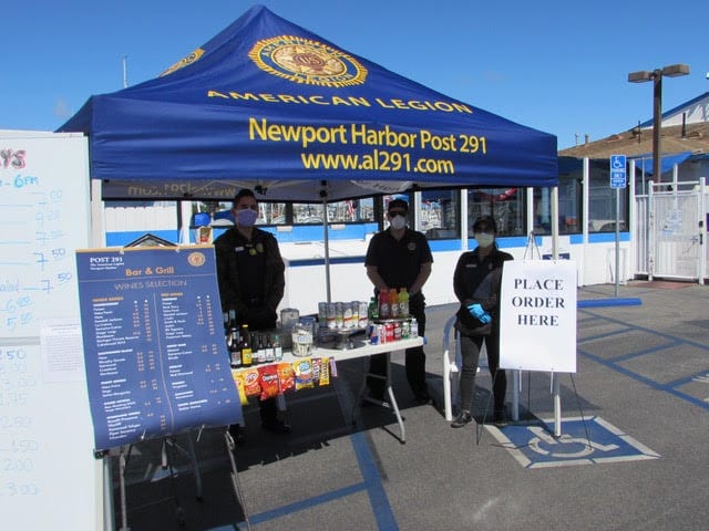 Newport Harbor Post 291 operates a drive-thru food service in its parking lot during the coronavirus quarantine
