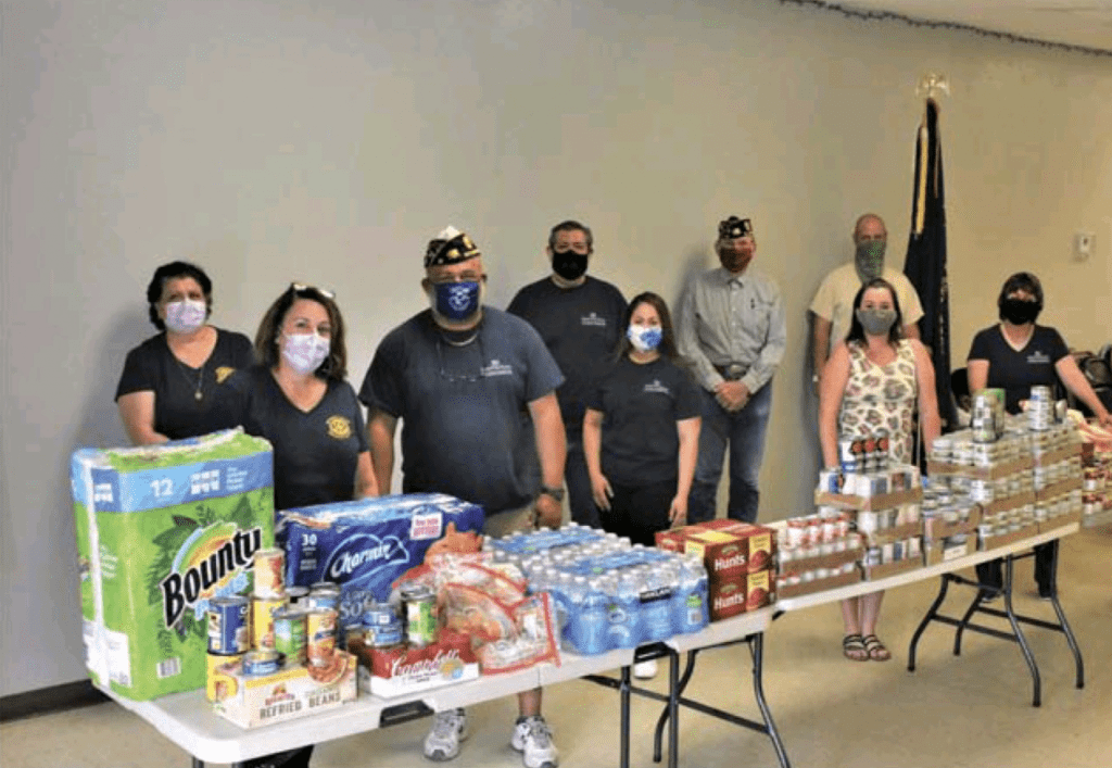 Members of American Legion Post 25, the Imperial Valley Patriotic Planning Committee and the Imperial Valley Breakfast Rotary Club gathered Friday evening to present Assistant Public Administrator Sarah Enz (front row, second from right) foodstuffs and other supplies to assist local senior citizens.