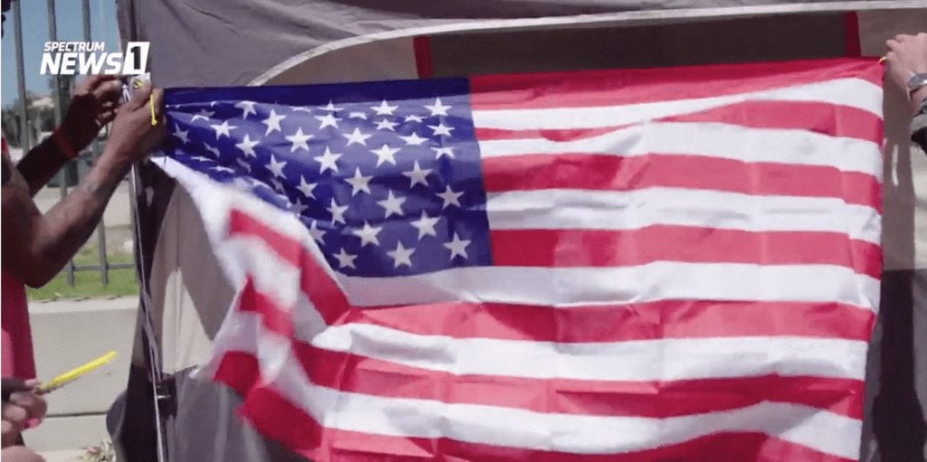 american flag attached to a tent for homeless veteran