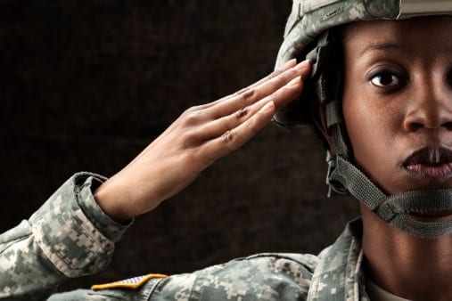 women veteran saluting in uniform