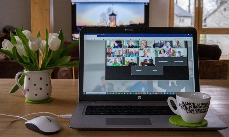 laptop open to a virtual meeting