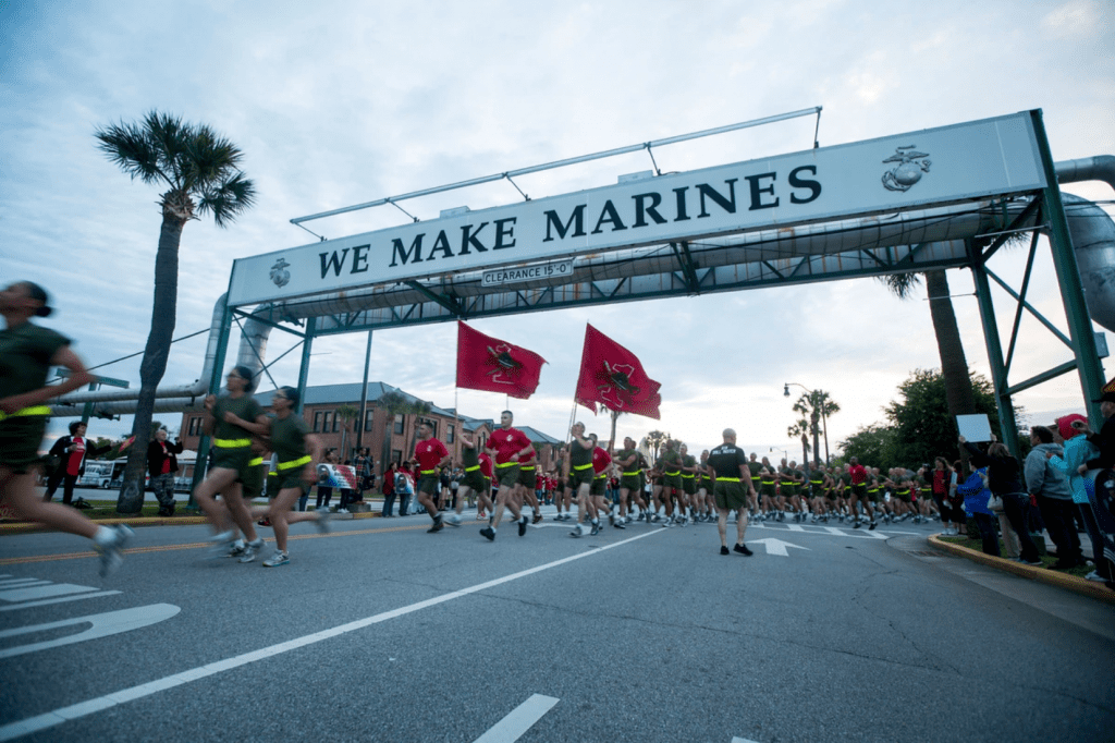 New Marines run under the iconic "We Make Marines" sign during a motivational run at Parris Island, S.C., April 14, 2016. (Lance Cpl. Aaron Bolser/Marine Corps)