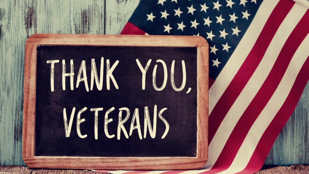 thank you veterans sign and american flag