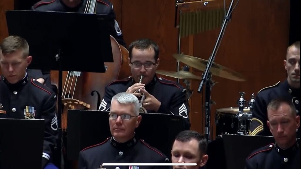 member of the West Point Band playing the trumpet at Post 105's Memorial Day commemoration