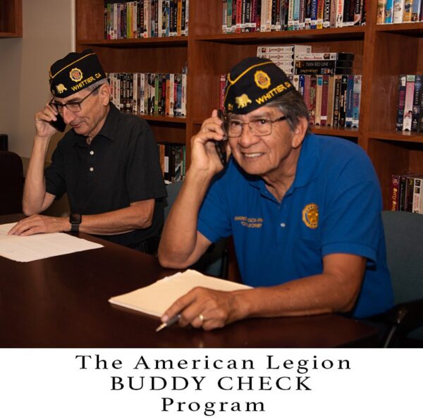 Photo of two Legionnaires make Buddy Check phone calls