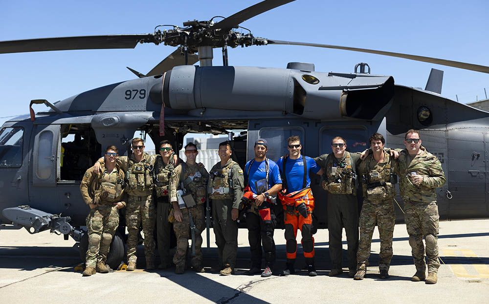 Airmen from the 129th and 131st Rescue Squadrons stand for a group photo at Moffett Air National Guard Base after successfully rescuing an injured man off a ship in the Pacific Ocean, Aug. 7. (U.S. Air National Guard photo by Staff Sgt. Crystal Housman)