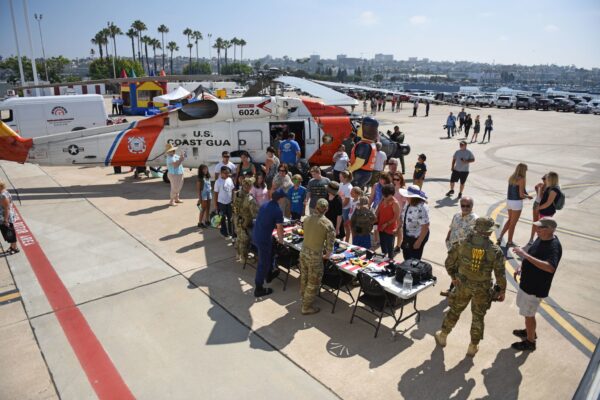 A group of people visit a U.S. Coast Guard celebration on Aug. 4, 2017 in San Diego, CA