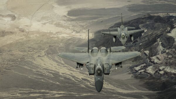 U.S. F-16 and F-15 flying over California desert.