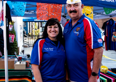 Commander Jere Romano and his wife Martha in front of an American Legion booth at the LACC Annual Tamale Festival