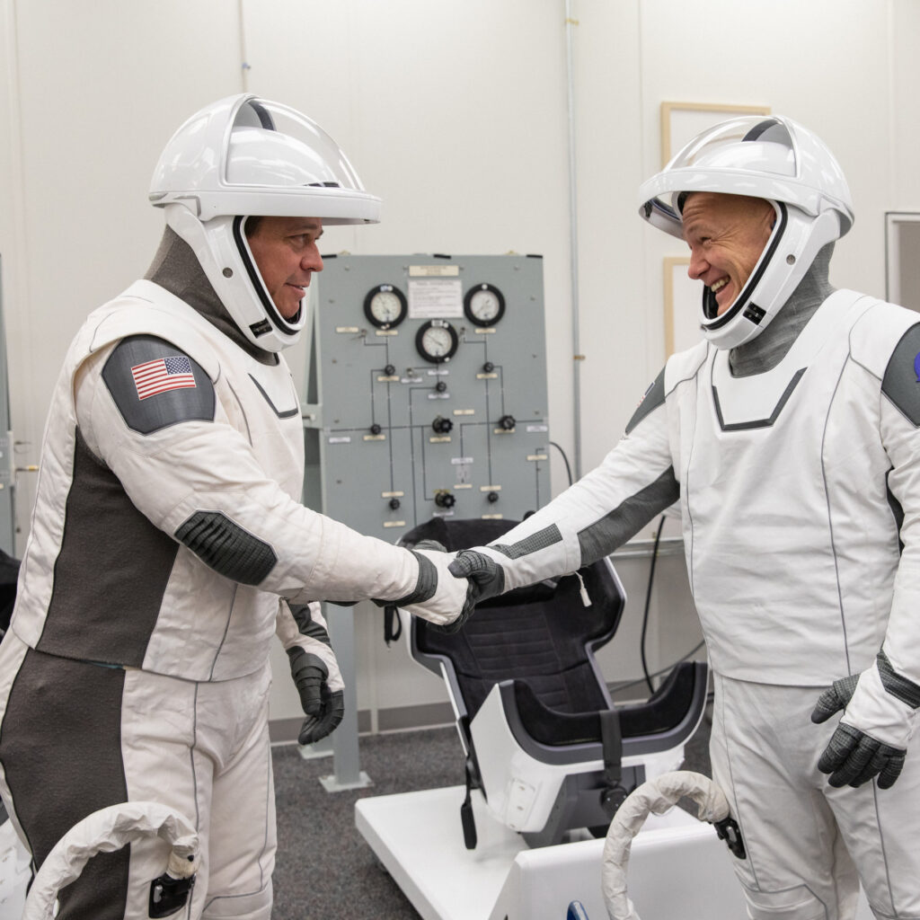 The astronauts Robert L. Behnken, left, and Douglas G. Hurley, donning their spacesuits during a dress rehearsal of SpaceX’s uncrewed In-Flight Abort Test in January (NASA photo).