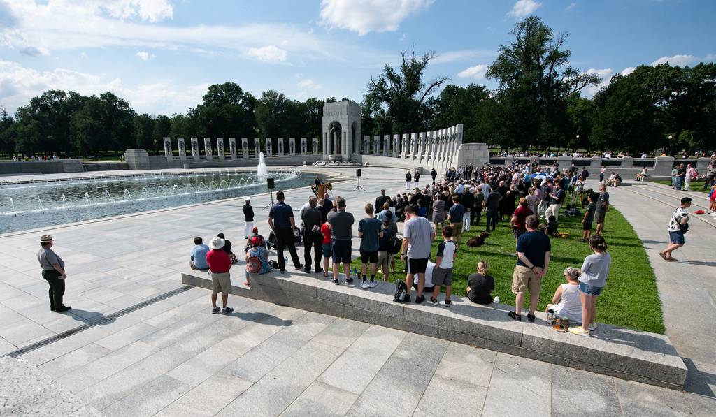 Visitors gather at the World War II Memorial in Washington
