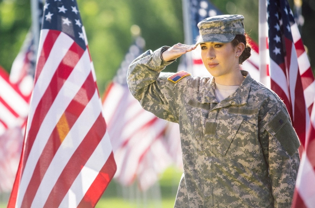 woman veteran saluting the flag