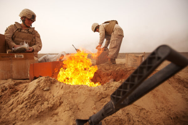 U.S. Marines dispose of trash in a burn pit, Afghanistan 2012 (Photo: Cpl Alfred V. Lopez)