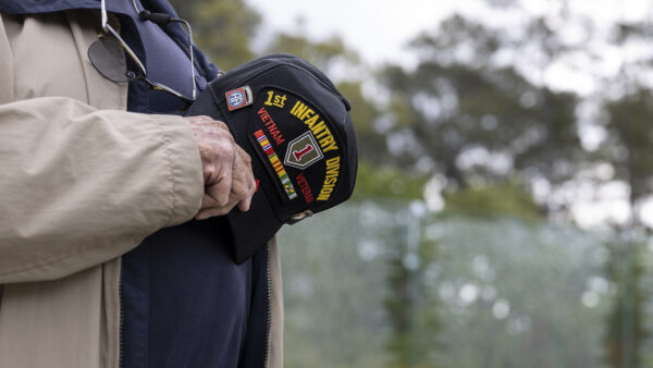 Retired U.S. army soldier stands during the playing of the National Anthem during a Vietnam Veterans Recognition ceremony