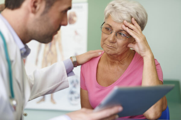 Doctor consoling patient