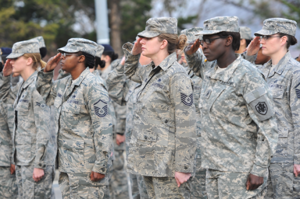 women service members at retreat