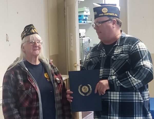 District 3 Commander Josh Bowers presents Linda Newman, representing Alturas Post 163, an award for achieving 125% membership